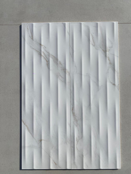 Piastrelle 25x75 Motif Extra calacatta gold lucido in rilievo