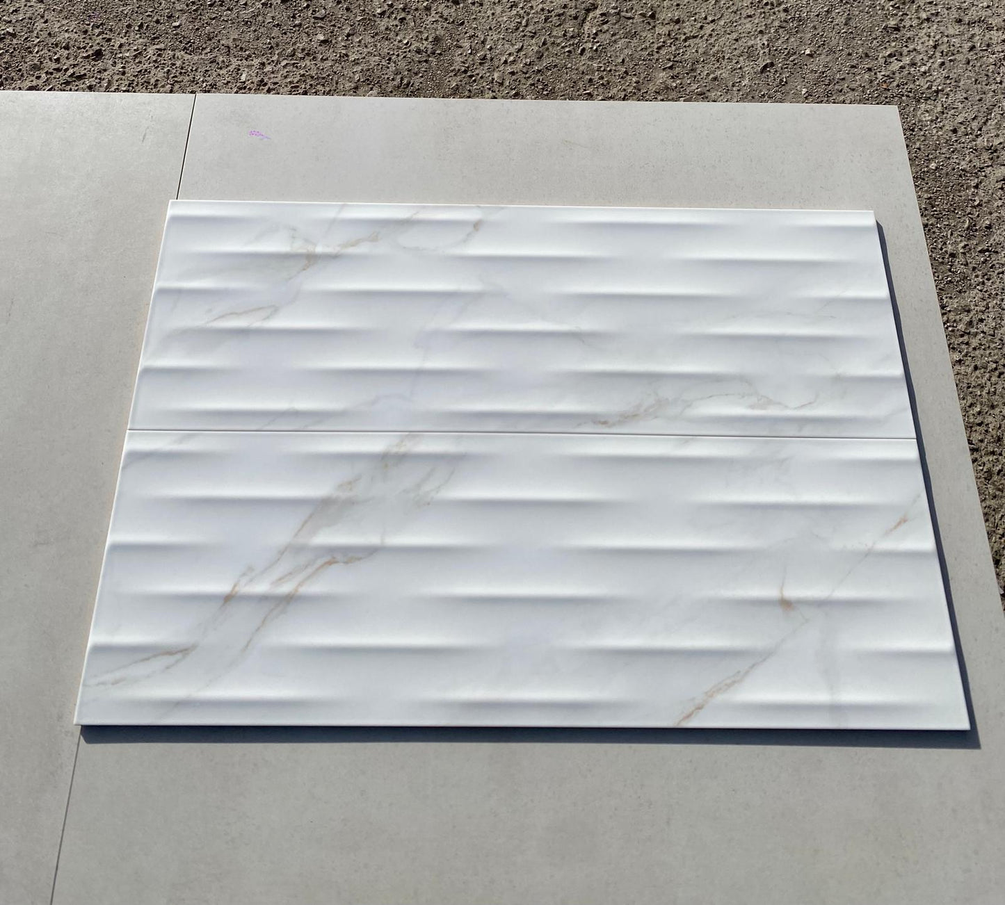 Piastrelle 25x75 Motif Extra calacatta gold lucido in rilievo