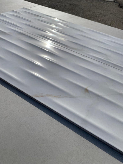 Piastrelle 25x75 Motif Extra calacatta gold lucido in rilievo